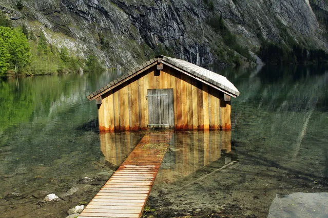This photo provided by courtesy of Little, Brown and Company from the book "Cabin p*rn: Inspiration for your quiet place somewhere" shows a boathouse on the Obersee, a lake in Bavaria, Germany. (Photo by Jenn and Willie Witte/Little, Brown and Company via AP Photo)