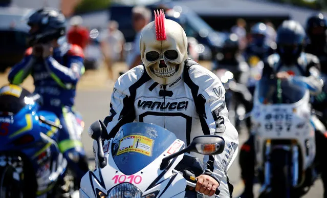Motorbike enthusiast Nico Knappe from Berlin lines up with his self-made skull helmet to compete in an airport racing event in Bottrop-Kirchhellen, western Germany, August 5, 2018. (Photo by Wolfgang Rattay/Reuters)