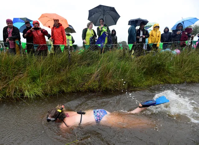 A competitor takes part in the World Bog Snorkelling Championships in Waen Rhydd peat bog at Llanwrtyd Wells in Wales, Britain on August 27, 2018. (Photo by Rebecca Naden/Reuters)