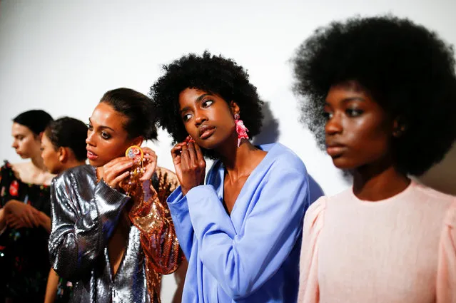 Models prepare backstage of the Roberta Einer show during London Fashion Week in London, Britain on September 18, 2018. (Photo by Henry Nicholls/Reuters)
