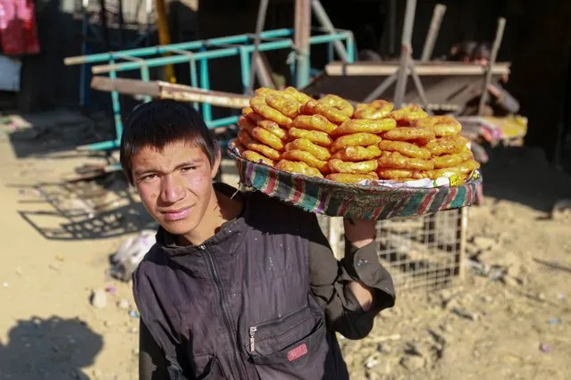 An Afghan man sells sweets on a roadside in Kabul, Afghanistan, 30 July 2023. A high-level Taliban government delegation will meet with representatives of the United States this week in Doha to hold talks on issues of mutual interest, foreign ministry spokesperson Abdul Qahar Balkhi said in a statement. The US state department on 26 July said that Washington's special representative for Afghanistan, Thomas West, and special envoy for Afghan women, girls, and human rights – Rina Amiri – would meet with Taliban representatives in Qatar to discuss critical interests in Afghanistan. (Photo by Samiullah Popal/EPA/EFE)