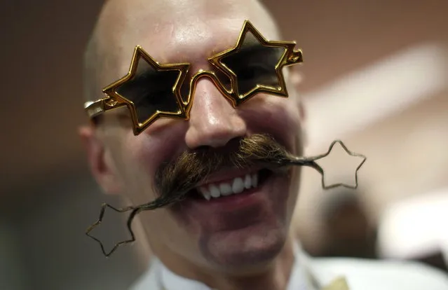 Daniel Lablor of the U.S. poses with his beard art work before the Beard World Championship 2013 in Leinfelden-Echterdingen near Stuttgart November 2, 2013. More than 300 people from around the world compete in different moustache and beard categories. (Photo by Michaela Rehle/Reuters)