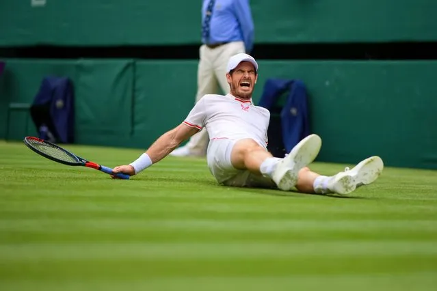 Andy Murray of Great Britain slips over on the grass during his match against Dennis Shapovalov of Canada in the third round of the gentlemen's singles during Day Five of The Championships – Wimbledon 2021 at All England Lawn Tennis and Croquet Club on July 02, 2021 in London, England. (Photo by TPN/Getty Images)