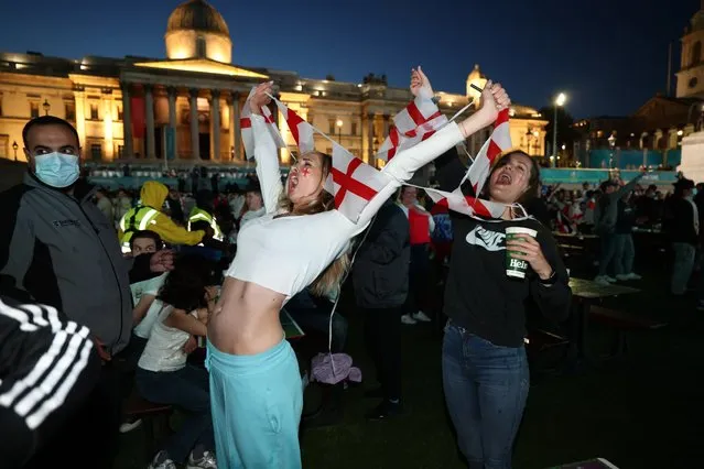 England fans celebrate after England defeated Denmark 2-1 on Wednesday to face Italy in the Euro 2020 final in Fan Zone in London's Trafalgar Square, United Kingdom on July 7, 2021. (Photo by London News Pictures)