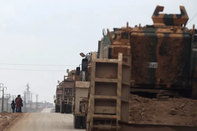 Turkish military vehicles drive in the Syrian rebel-held town of al-Rai, as they head towards the northern Syrian town of al-Bab, Syria January 4, 2017. (Photo by Khalil Ashawi/Reuters)