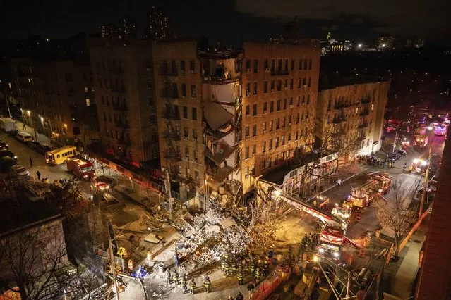 First responders work at the scene of a collapsed building in the Bronx borough of New York, Monday, December 11, 2023. (Photo by Yuki Iwamura/AP Photo)