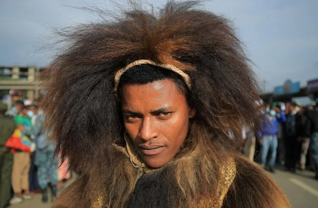 A man dressed in traditional Oromo costume attends a rally to support the National Defense Force and to condemn the expansion of the Tigray People Liberation Front (TPLF) fighters into Amhara and Afar regional territories at the Meskel Square in Addis Ababa, Ethiopia on August 8, 2021. (Photo by Tiksa Negeri/Reuters)