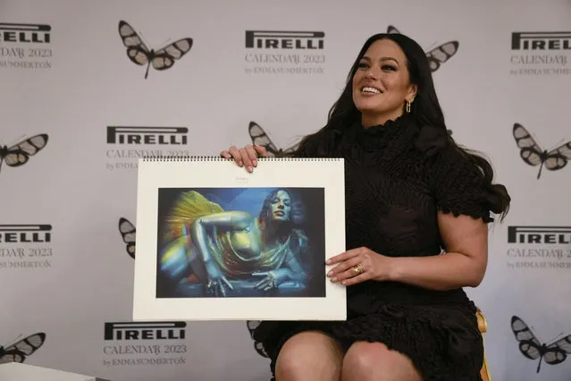 Model Ashley Graham holds her picture on the Pirelli calendar as she discusses her appearance in the 2023 Pirelli calendar during a press preview at the 15th Century Bicocca degli Arcimboldi Villa at Pirelli's headquarters in Milan, Italy, Tuesday, November 15, 2022. The 2023 calendar titled “Love Letters to the Muse” was shot by Australia photographer Emma Summerton and features models representing their personal passions. (Photo by Luca Bruno/AP Photo)