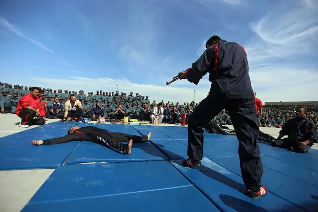 Afghan police officials perform during their graduation ceremony in Herat, Afghanistan, 25 February 2016. Afghan national security forces took over full responsibility for the country's security on 01 January 2015, as NATO-led coalition forces ended their 13-year-old active combat mission and started a new phase providing training, advice, and assistance. However, the country has since experienced an increase in attacks. (Photo by Jalil Rezayee/EPA)
