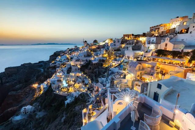 In the evenings people gather to watch the sunset over the town of Oia on the northern tip of Santorini’s crater. The view is incredible, so much so that the sunset has now become a bucket-list tourist attraction. (Photo by Matt Parry/National Geographic Traveller UK)