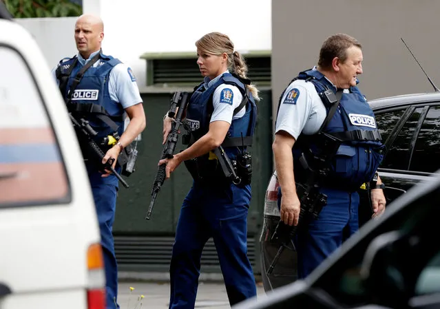 Armed police patrol outside a mosque in central Christchurch, New Zealand, Friday, March 15, 2019. A witness says many people have been killed in a mass shooting at a mosque in the New Zealand city of Christchurch. (Photo by Mark Baker/AP Photo)