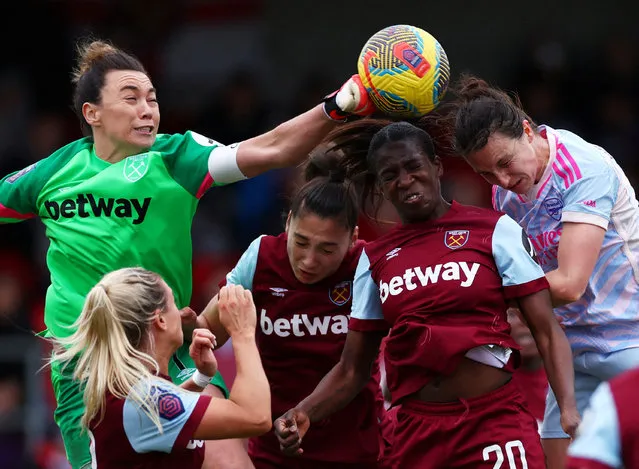 West Ham United's Mackenzie Arnold, Amber Tysiak and Viviane Asseyi in action with Arsenal's Lotte Wubben-Moy during the Barclays Women´s Super League match between West Ham United and Arsenal FC at Chigwell Construction Stadium on February 04, 2024 in Dagenham, England. (Photo by Andrew Boyers/Action Images via Reuters)