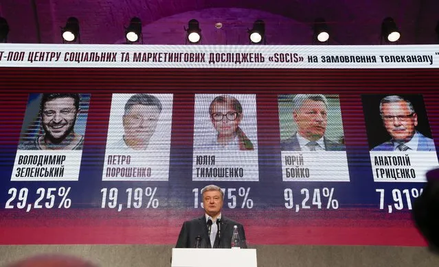 Ukrainian President Petro Poroshenko speaks at his headquarters after the presidential election in Kiev, Ukraine, Sunday, March 31, 2019. The exit poll released Sunday after voting stations closed indicated that Zelenskiy received about 30.4 percent of the nationwide vote, followed by incumbent President Petro Poroshenko with 17.8 percent and former Prime Minister Yulia Tymoshenko with 14.2 percent support. (Photo by Efrem Lukatsky/AP Photo)