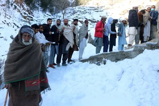 People line up to cast their ballot at a polling station, during general elections in Kaghan Valley, Pakistan, 08 February 2024. Pakistani voters headed to heavily guarded polling stations on 08 February, to elect a new government for a five-year term amid increased security threats. According to the election body, the polling started at 8 a.m. local time and will continue until 5 p.m. The counting of millions of votes cast will start soon after polling time is over. There are more than 128 million registered voters, 59.3 million (46 percent) women and 69.2 million or 54 percent men. More than 20 million new voters have been registered for the 2024 elections. There are nearly 18,000 candidates out of whom 5,112 including 4797 males, 313 women, and two transgender contestants, running for 266 contestable parliamentary seats. (Photo by Amirudin Mughal/EPA/EFE)