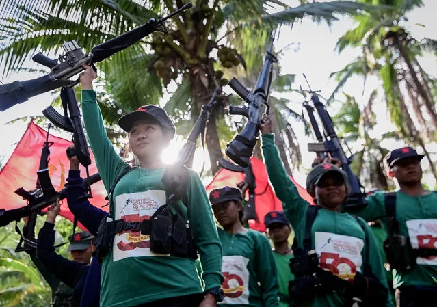Fighters of the New People's Army-Melito Glor Command (NPA-MGC) conduct a drill during their 50th founding anniversary celebration at an undisclosed location in the mountains of Sierra Madre, Philippines, 31 March 2019. The rebellion has left about 40,000 combatants and civilians dead. It has stunted economic development, especially in the countryside, where the military says about 3,500 insurgents are still active. (Photo by Alecs Ongcal/EPA/EFE)