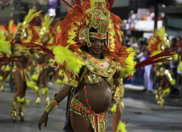 A pregnant reveller of the Salgueiro samba school participate in the annual Carnival parade in Rio de Janeiro's Sambadrome, March 3, 2014. (Photo by Pilar Olivares/Reuters)