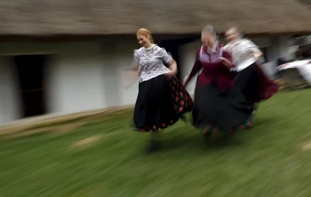 Girls run as boys throw water at them as part of traditional Easter celebrations in Szenna, Hungary, March 28,2016. (Photo by Laszlo Balogh/Reuters)