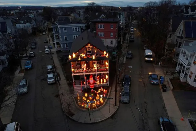 A house is covered in lights for the Christmas season in Somerville, Massachusetts, U.S., December 7, 2021. (Photo by Brian Snyder/Reuters)