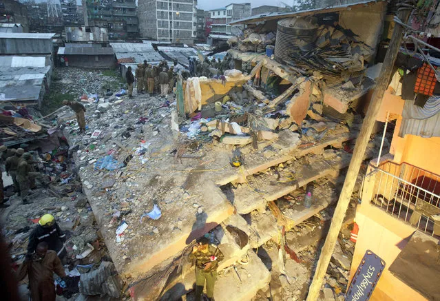 Rescuers work at the site of a building collapse in Nairobi, Kenya, Saturday, April 30, 2016. (Photo by Sayyid Abdul Azim/AP Photo)