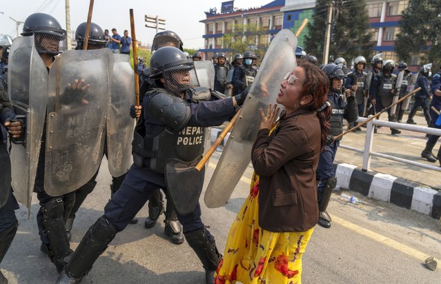 Policemen baton charge supporters of Rastriya Prajatantra Party, or national democratic party during a protest demanding a restoration of Nepal's monarchy in Kathmandu, Nepal, Tuesday, April 9, 2024. Riot police used batons and tear gas to halt thousands of supporters of Nepal's former king demanding the restoration of the monarchy and the nation's former status as a Hindu state. Weeks of street protests in 2006 forced then King Gyanendra to abandon his authoritarian rule and introduce democracy. (Photo by Niranjan Shrestha/AP Photo)