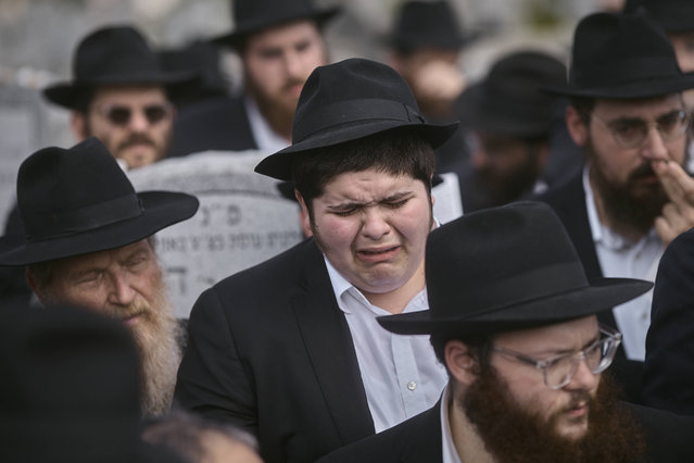 A Chabad-Lubavitch Hasidic Jew cries during the funeral of Rabbi Moshe Kotlarsky, Vice Chairman of Merkos L'Inyonei Chinuch—the educational arm of the Chabad-Lubavitch movement—and Director of the annual International Conference of Chabad-Lubavitch Emissaries, at Montefiore Cemetery, on Wednesday, June 5, 2024, in the Queens borough of New York. Kotlarsky passed away on Tuesday. He would have been 75 in four days. (Photo by Andres Kudacki/AP Photo)