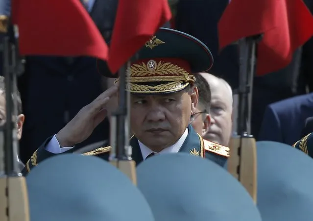  Russian Defence Minister Sergei Shoigu watches honor guards passing by during a wreath-laying ceremony to mark the 71st anniversary of the victory over Nazi Germany in World War Two, at the Tomb of the Unknown Soldier by the Kremlin walls in Moscow, Russia, May 9, 2016. (Photo by Maxim Shemetov/Reuters)