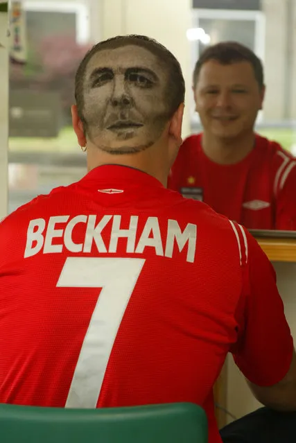 Nick Prior (34) from Bognor Regis has had his local barber, Daren Terry, shave a portrait of David Beckham onto the the back of his head. He says he will keep it like this as long as England are still in Euro 2004. (Photo by Southern News & Pictures)