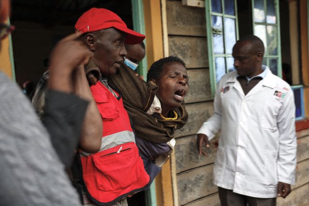 A woman reacts after visiting the burned dorm room at the Nyeri county's Hillside Endarasha Academy in Nyeri county on September 6, 2024 after a fire broke out killing 17 children. At least 17 children died after a fire ripped through their primary school dormitory in central Kenya, police said Friday September 06, 2024. The blaze in Nyeri county's Hillside Endarasha Academy broke out at around midnight, police said, engulfing rooms where the children were sleeping. (Photo by Simon Maina/AFP Photo)