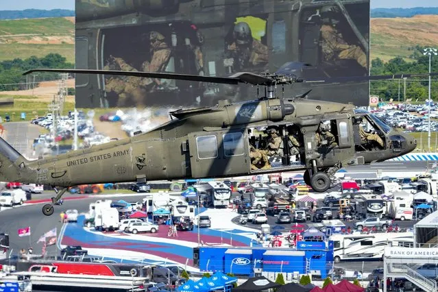 US Army Fort Bragg Blackhawk helicopter flies in for the Memorial Day ceremony during the Coca-Cola 600 at Charlotte Motor Speedway in Concord, North Carolina on May 29, 2022. (Photo by Jim Dedmon/USA TODAY Sports)