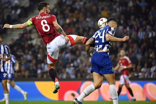 Manchester United's Portuguese midfielder #08 Bruno Fernandes fouls FC Porto's Argentine defender #24 Nehuen Perez during the UEFA Europa League 1st round day 2 between FC Porto and Manchester United at the Dragao stadium in Porto on October 3, 2024. (Photo by Miguel Riopa/AFP Photo)