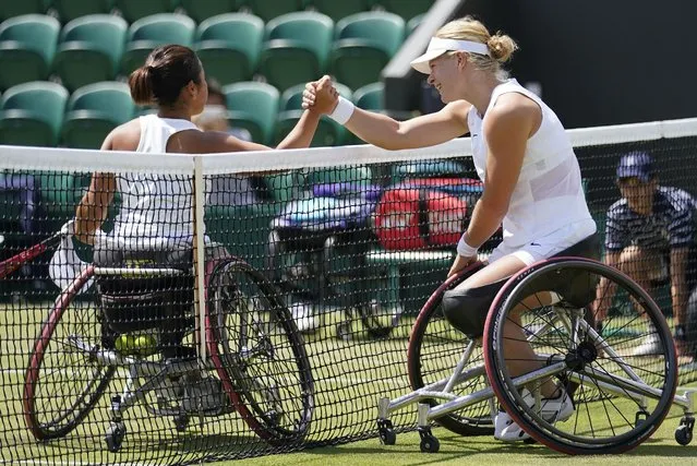 Diede De Groot of the Netherlands, right, greets Japan's Yui Kamiji at the net after winning the final of the women's wheelchair singles on day thirteen of the Wimbledon tennis championships in London, Saturday, July 9, 2022. (Photo by Gerald Herbert/AP Photo)
