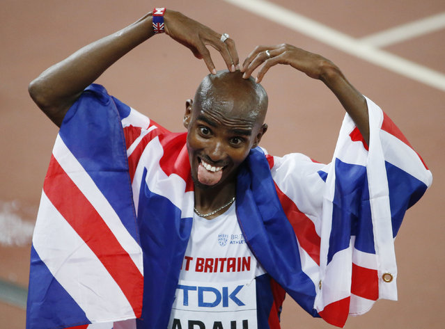 Mo Farah of Britain celebrates winning the men's 10,000 metres final at the 15th IAAF World Championships at the National Stadium in Beijing, China August 22, 2015. (Photo by David Gray/Reuters)