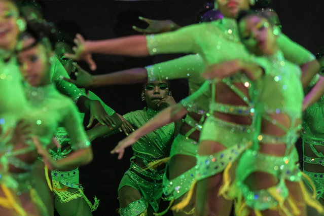 Dancers perform during the 18th World Salsa Festival in Cali, Colombia on October 5, 2023. (Photo by Joaquín Sarmiento/AFP Photo)
