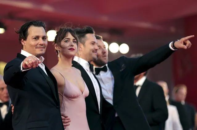 Cast members Johnny Depp (L), Dakota Johnson and Joel Edgerton (R) pose with director Scott Cooper (2nd R) during the red carpet event for the movie “Black Mass” at the 72nd Venice Film Festival in northern Italy September 4, 2015. (Photo by Manuel Silvestri/Reuters)