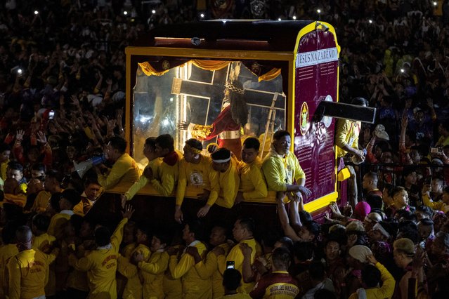 Filipino Catholic devotees surround the carriage carrying the statue of the Black Nazarene as its annual procession begins on its feast day in Manila, Philippines, on January 9, 2025. (Photo by Eloisa Lopez/Reuters)