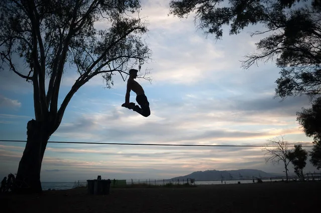 A man is seen practising slackline at “Baños del Carmen” during the partial lockdown after the beginning of phase 1 in some cities of Spain, amid coronavirus crisis on May 11, 2020. Spain is going through the plan of downscaling towards a “new normality” by relaxing measures, caused by the outbreak of COVID-19 disease, following an ongoing plan that began on 4 May formed in four phases (0-1-2-3) to leave the confinement in the country. Cities as Madrid, Barcelona, Malaga or Granada continue in phase 0 until next week due to the epidemiological opinions of sanitary authorities. (Photo by Jesus Merida/SOPA Images/Rex Features/Shutterstock)