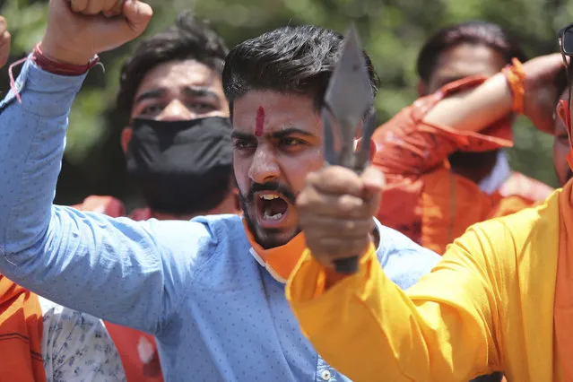 Activists of Rashtriya Bajrang Dal shout slogans during a protest against the Chinese government in Jammu, India, Wednesday, June 17, 2020. As some commentators clamored for revenge, India's government was silent Wednesday on the fallout from clashes with China's army in a disputed border area in the high Himalayas that the Indian army said claimed 20 soldiers' lives. An official Communist Party newspaper said the clash occurred because India misjudged the Chinese army’s strength and willingness to respond. (Photo by Channi Anand/AP Photo)