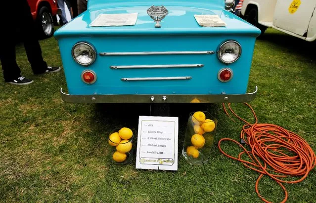 Lemons are placed in front of a 1973 Electra-King 3-Wheel Electric Car during the Concours d'LeMons in Seaside, California, U.S. August 20, 2016. (Photo by Michael Fiala/Reuters/Courtesy of The Revs Institute)