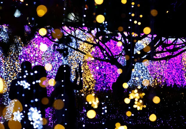 People visit the “Thailand Illumination Festival 2017” in Bangkok, Thailand, 05 December 2017. The festival is held in remembrance of late Thai King Bhumibol Adulyadej and in honor of Thai King Maha Vajiralongkorn Bodindradebayavarangkun. With more than one million LED lights, the exhibition is for free to the public and will be held until 06 January 2018. (Photo by Narong Sangnak/EPA/EFE)