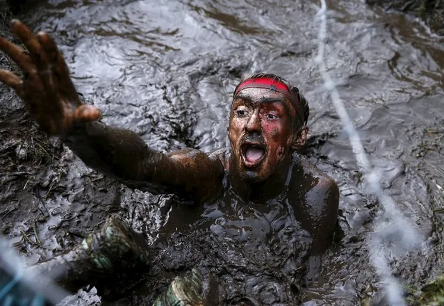 A man takes part in an extreme run competition in Zhodino, east of Minsk, September 26, 2015. (Photo by Vasily Fedosenko/Reuters)