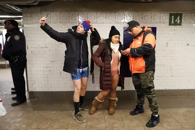 People participate in the annual “No Pants Subway Ride” in New York City on January 7, 2018. (Photo by Elizabeth Shafiroff/Reuters)