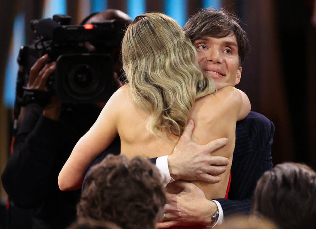 Irish actor Cillian Murphy is embraced by British actress Emily Blunt after winning Best Male Actor in a Leading Role for Oppenheimer during the 30th Screen Actors Guild Awards, in Los Angeles, California, U.S., February 24, 2024. (Photo by Mario Anzuoni/Reuters)