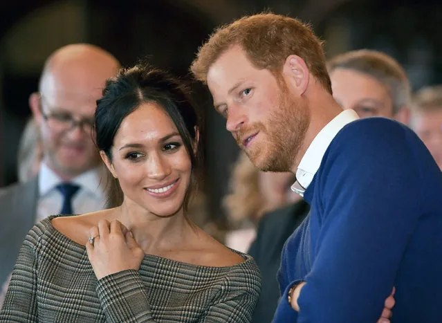 Britain's Prince Harry and Meghan Markle watch a dance performance by Jukebox Collective Cardiff Castle in Cardiff, Wales, Thursday, January 18, 2018. During their tour, Prince Harry and Ms. Markle will hear performances from musicians and poets, meet sportsmen and women, and see how organisations are working to promote Welsh language and cultural identity. (Photo by Ben Birchall/Pool Photo via AP Photo)