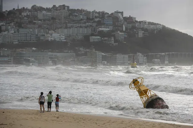 A general view shows a buoy that was un-tethered during heavy swell brought by Typhoon Maysak overnight on Haeundae beach in Busan on September 3, 2020. (Photo by Ed Jones/AFP Photo)