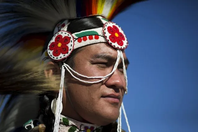 A reveller takes part in a "pow-wow" celebrating the Indigenous Peoples Day Festival in Randalls Island, New York, October 12, 2015. (Photo by Eduardo Munoz/Reuters)