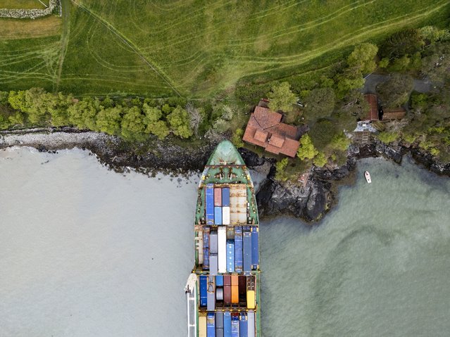 The container ship NCL Salten ran aground at Byneset, outside Trondheim, Norway. A man in Norway woke up to find a massive container ship in his front garden. The 135-metre (443-foot) vessel missed Johan Helberg's house by a few metres at around 5am local time on Thursday, May 22, 2025 in Byneset, near Trondheim. Mr. Helberg was only made aware of the incident after his panicked neighbour, who had seen the ship heading straight for shore, repeatedly rang his doorbell and eventually called him on the phone. (Photo by South West News Service)