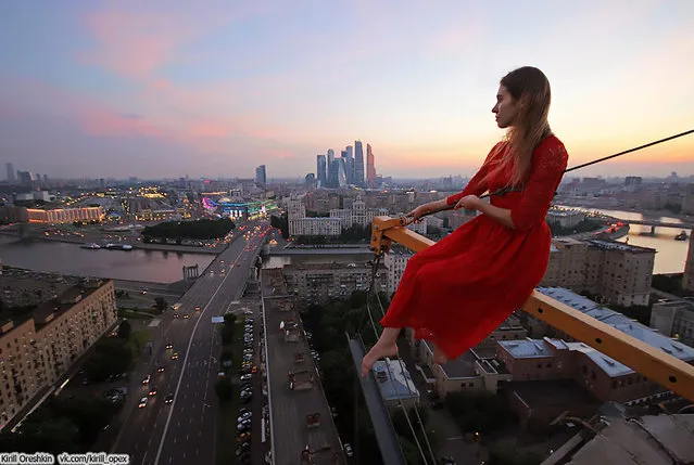 An astonishing set of snaps of a thrill-seeker's sky-high catwalk show on the edge of some of the world's tallest buildings has turned her into a social media sensation. Daredevil Angelina Nikolau, 23, from Russia, has spent weeks travelling around China and Hong Kong posing for jaw-dropping skyscraper selfies hundreds of feet above the ground. Her vertigo inducing results – uploaded to Instagram – have made her an instant star on the internet. Angelina is described by Russian media as “self-taught photographer, adventurer and roofer from Moscow”. (Photo by Kirill Oreshkin/CEN)