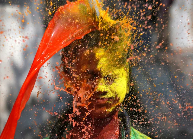 A boy reacts as coloured water is thrown on his face during Holi celebrations in Kolkata, India on March 2, 2018. (Photo by Rupak De Chowdhuri/Reuters)