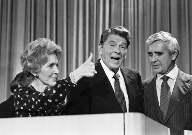 Nancy Reagan gives a thumbs up September 21, 1980 in Baltimore, when asked how she thought her husband, Republican presidential candidate Ronald Reagan did in the debate with Independent presidential candidate John Anderson. At right is Sen. Paul Laxalt (R-Nev.). (Photo by William Smith/AP Photo)