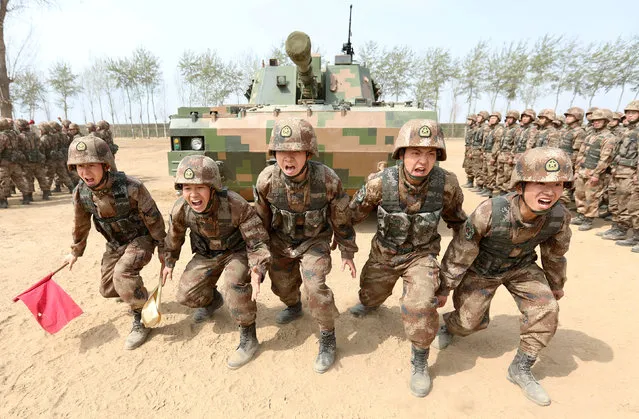 Soldiers of China's People's Liberation Army (PLA) are seen during a military promotional event in Baoding, Hebei province, China March 30, 2018. (Photo by Reuters/China Stringer Network)